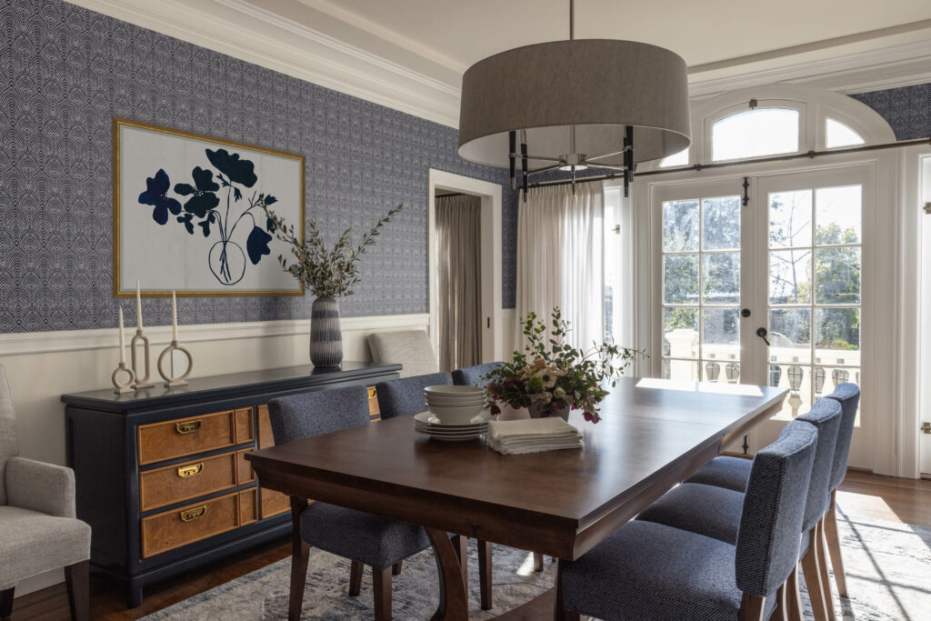 Napa Valley, Sonoma County and Marin interior designer designs a family friendly and functional dining room. Approachable and friendly interior designer. Bold blue wallpaper with a vintage sideboard and blue performance upholstered dining chairs.